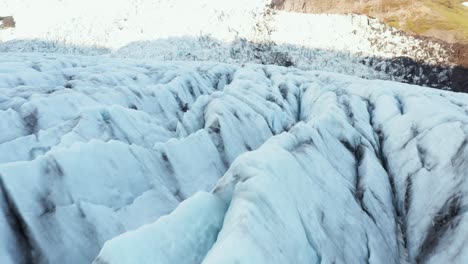 jagged cracked surface of virkisjökull glacier in iceland, aerial