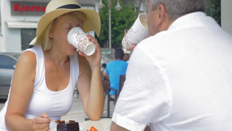 People-Drinking-Coffee-and-Eating-in-Coffeehouse