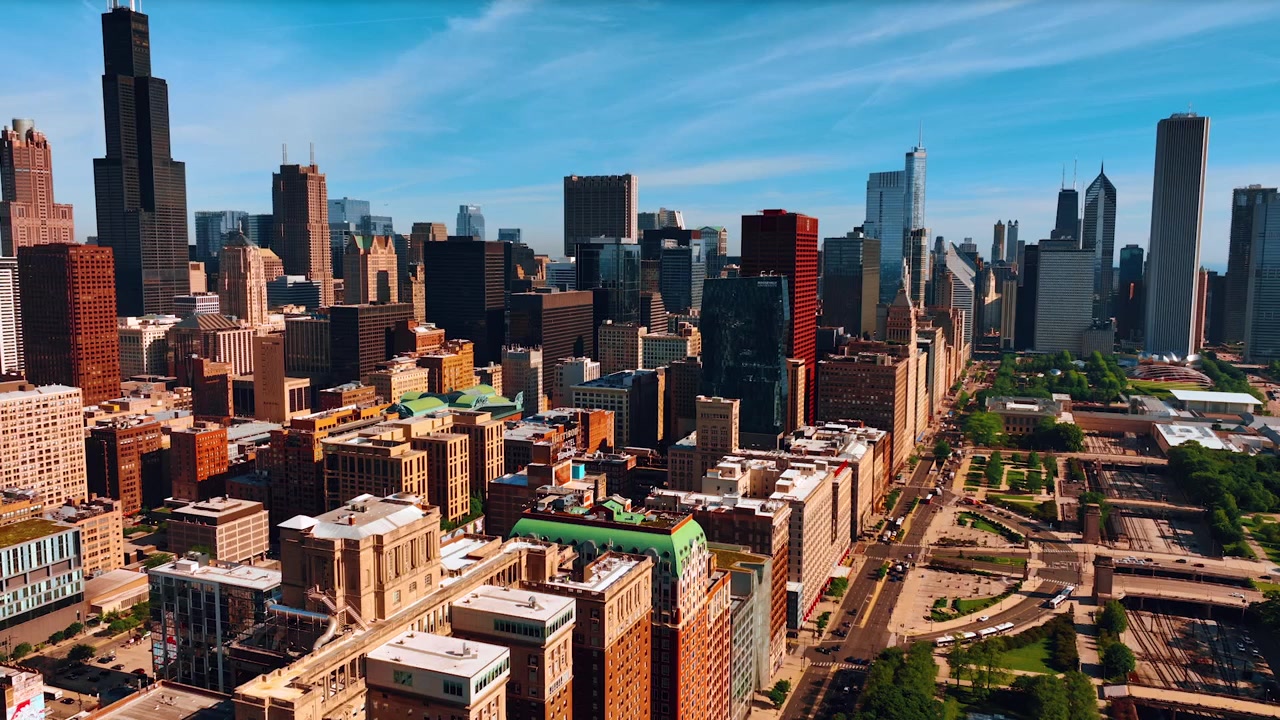 Low-rise and high-rise buildings in the scenery of Chicago, Illinois, United States. Architecture of a gorgeous city with the green park. Top view.