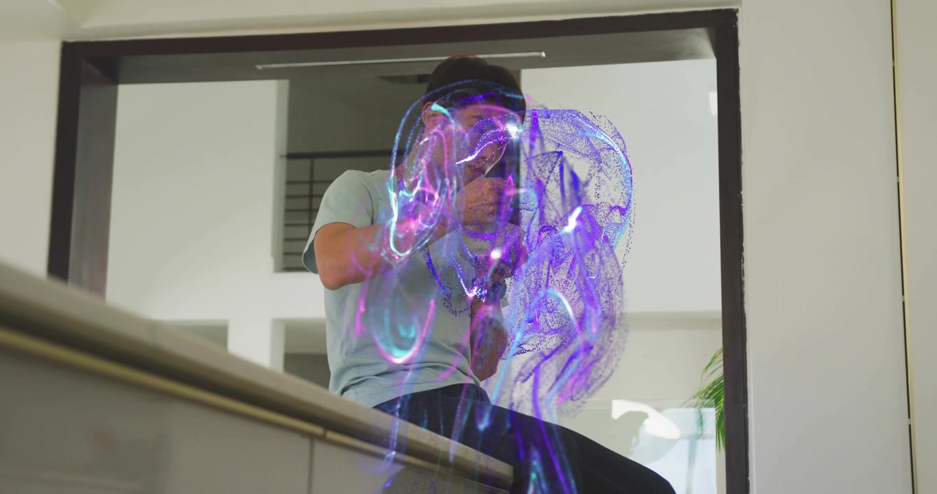 Teenage boy curiously scooping bowl on kitchen counter activating shimmering blue tech energy