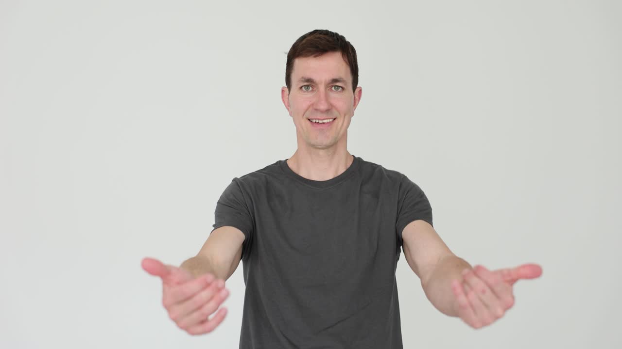 Man with inviting gesture on white background