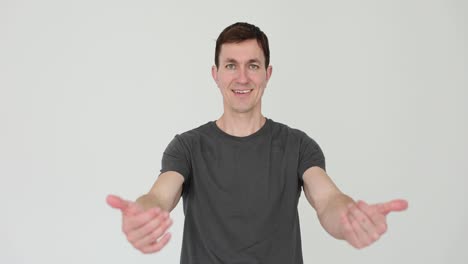 Man with inviting gesture on white background