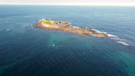 Aerial-drone-landscape-of-rocky-Moon-Island-Swansea-Belmont-Pacific-Ocean-nature-travel-tourism-NSW-Australia-Newcastle-4K