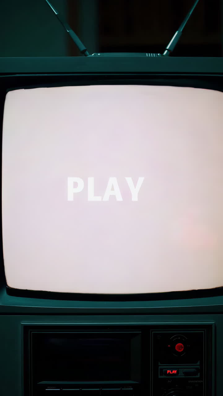 Retro Television with 'PLAY' Displaying Glitch Art and Static