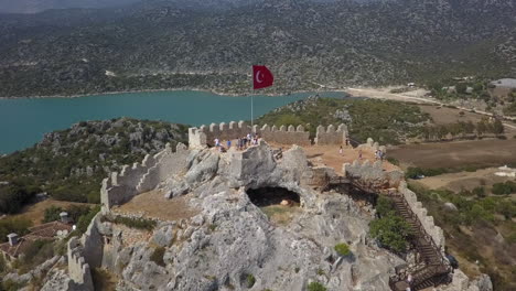 ancient fort ruin built over cave on stone hilltop in southern turkey