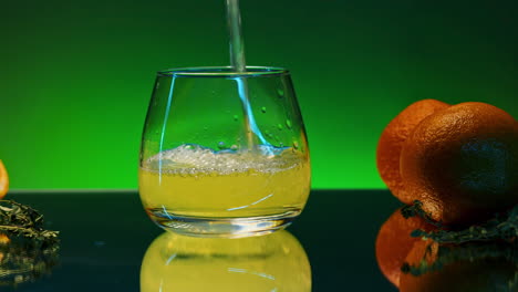 pouring orange juice into a glass