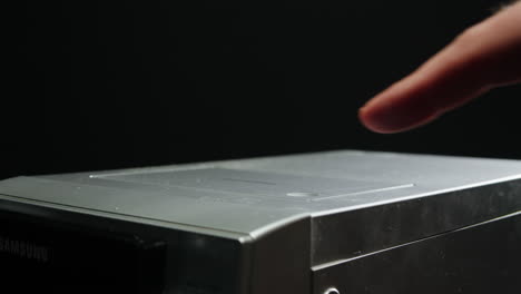 cassette tape player, close-up of a spinning vintage audio cassette in tape recorder. retro magnetic cassette plays music. selective focus, shallow depth of field