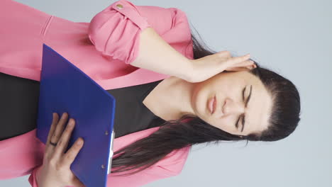 Vertical-video-of-Business-woman-scratching-her-ear.