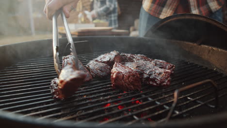 Turning-Meat-on-BBQ-Grill