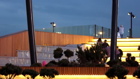 urban fountain at night with people