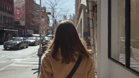 woman walking through a city street