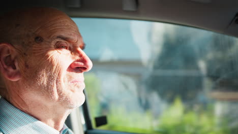 elderly man focused on driving to work