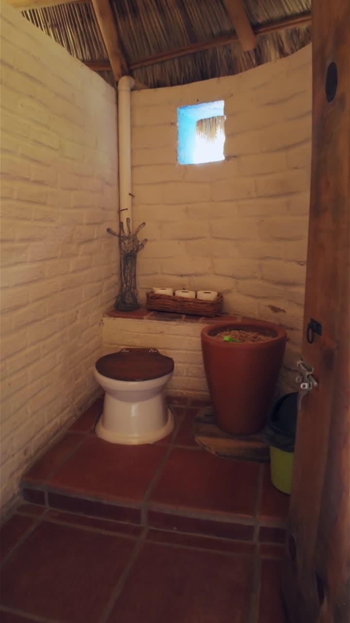Vertical View Of A Dry Bathroom Design Inside A Cob House. POV Shot