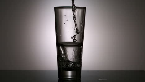 water pouring into a glass