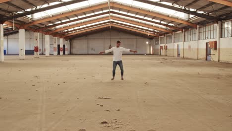 Male-dancer-in-an-empty-warehouse