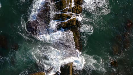 drone tracking close up shot sea waves crashing