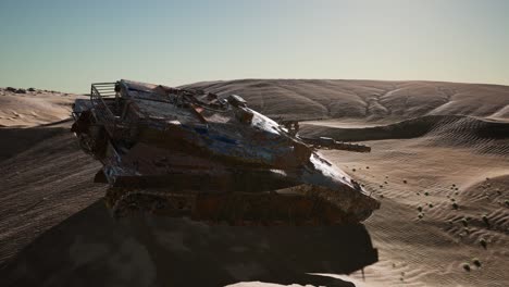 militairy tanks destructed in the desert at sunset