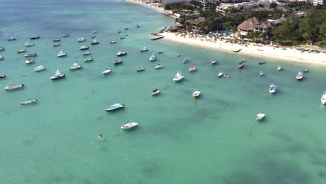 many yachts anchoring in playa del carmen beach harbor in sea waters