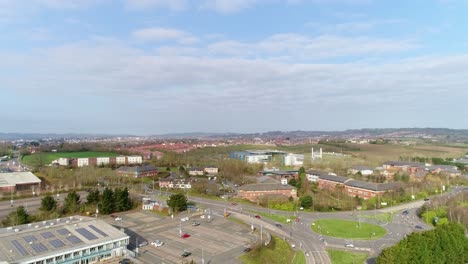 Aerial-tracking-upwards-to-reveal-Honiton-road-roundabout-on-the-edge-of-Sowton-business-estate