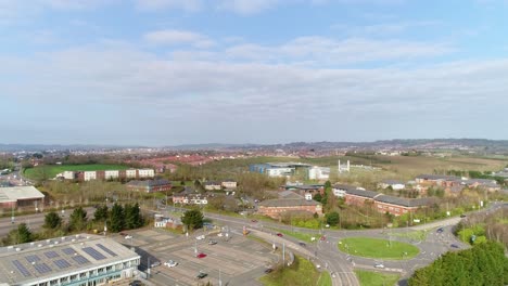 aerial tracking upwards to reveal honiton road roundabout on the edge of sowton business estate
