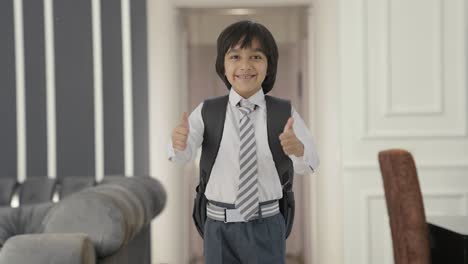 happy indian school boy showing thumbs up