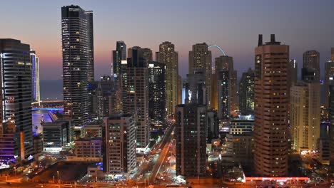 4k:skyscrapers of dubai marina district with modern buildings and city traffic