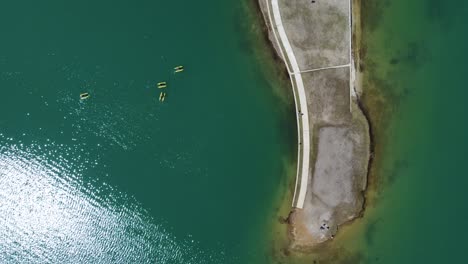 Top-view-aerial-shot-of-shore-in-lake-Plastira-in-Greece