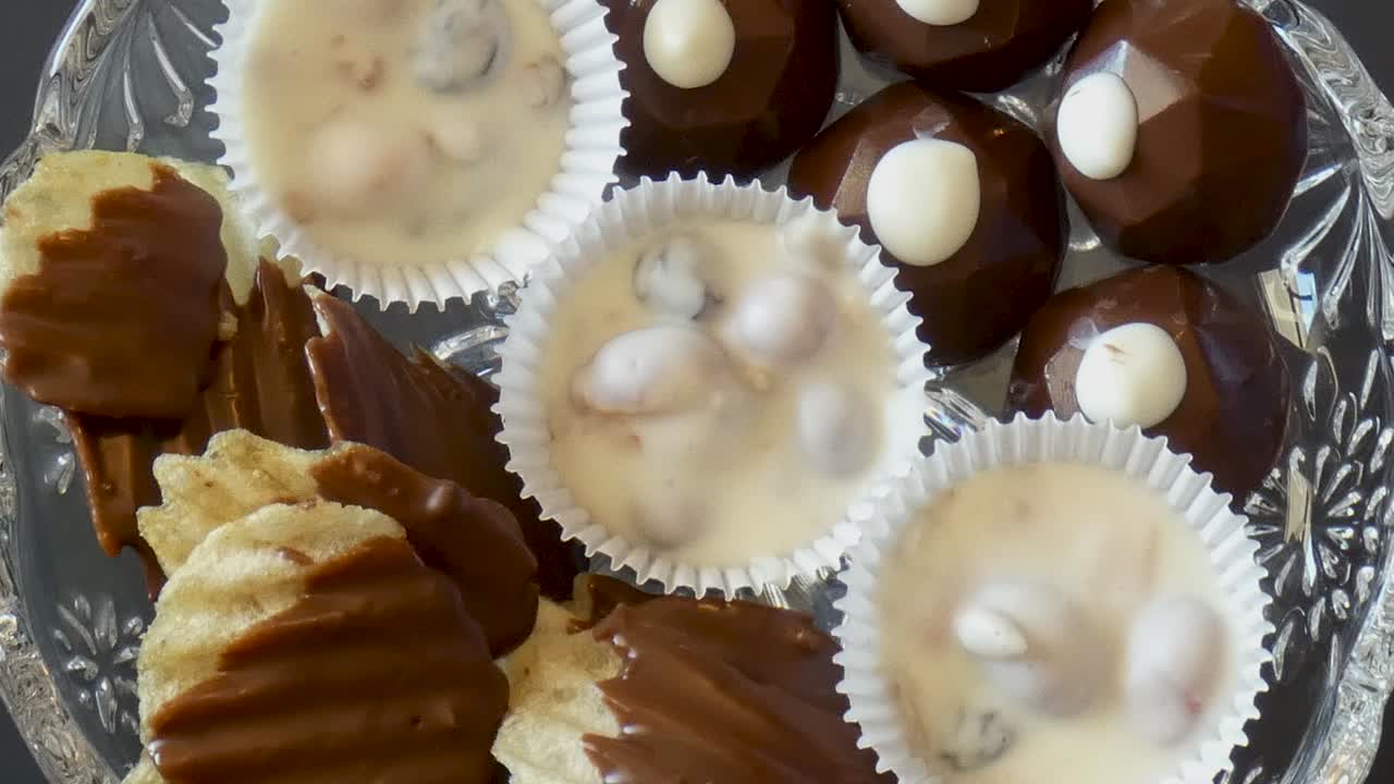 Candy dish spins with an assortment of chocolate candies