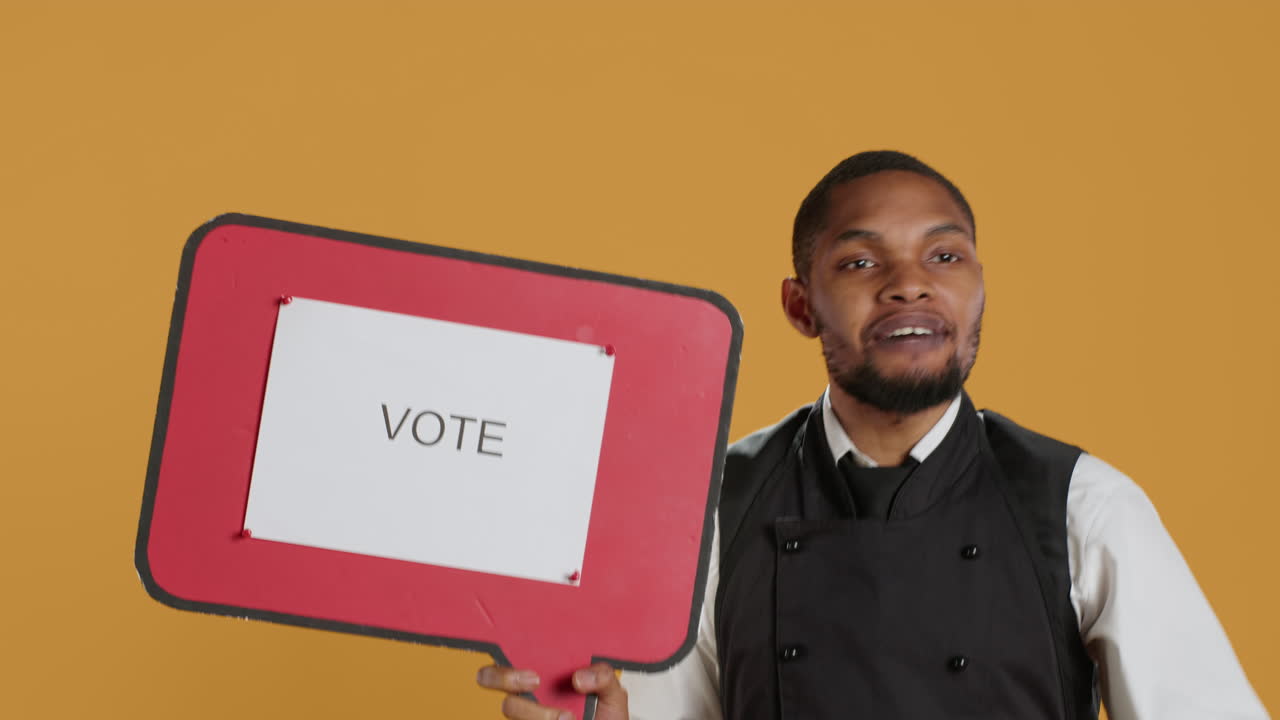 Waiter does an advertisement for politics and showing a speech bubble