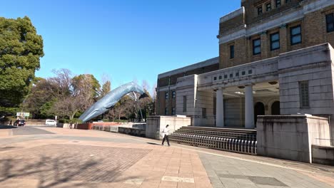 clear skies over an expansive plaza with a building