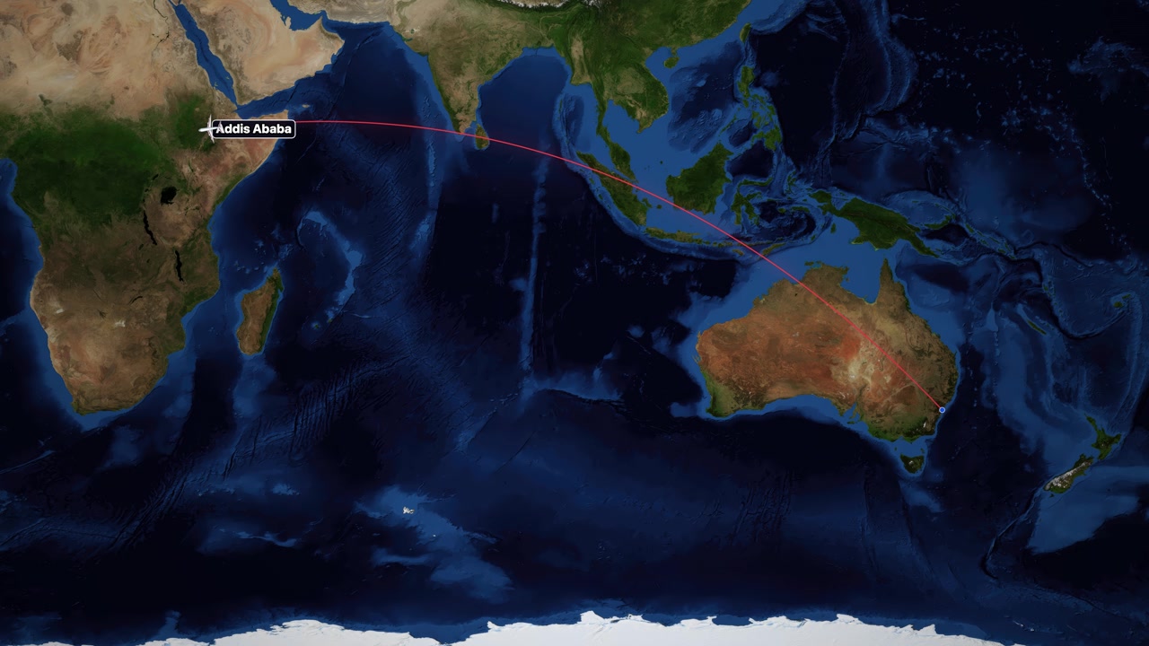Static wide shot satellite map follows red flight path from Sydney to Addis Ababa