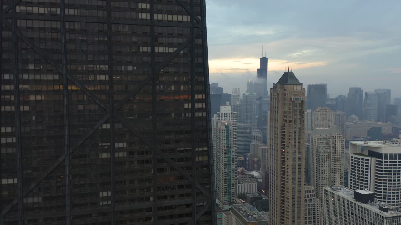 Crane Up Next to Iconic Chicago Skyscraper with Sears-Willis Tower in Background