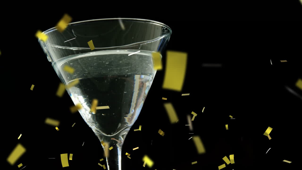검은색 바탕에 마르티니 글래스 위에 황금색 콘페티 애니메이션
