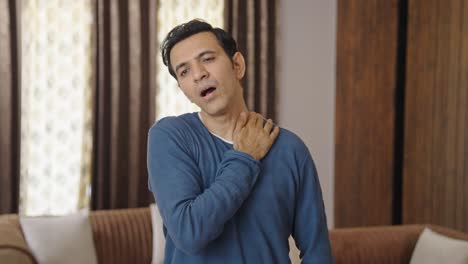 middle aged indian man having neck pain