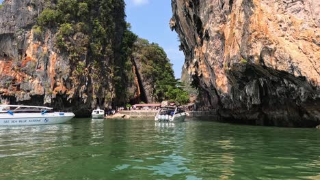 tourists enjoying a scenic boat ride by cliffs