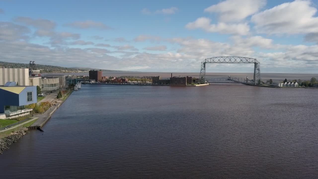 Aerial dolly right of Duluth Lift Bridge and Minnesota Basin in fall