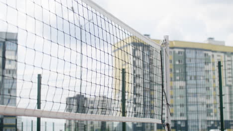 Volleyball-net-and-and-buildings-in-the-background