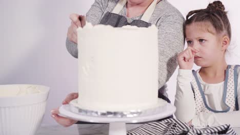 frosting round funfetti cake with white italian buttercream frosting.