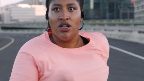 Running,-plus-size-and-black-woman-with-music