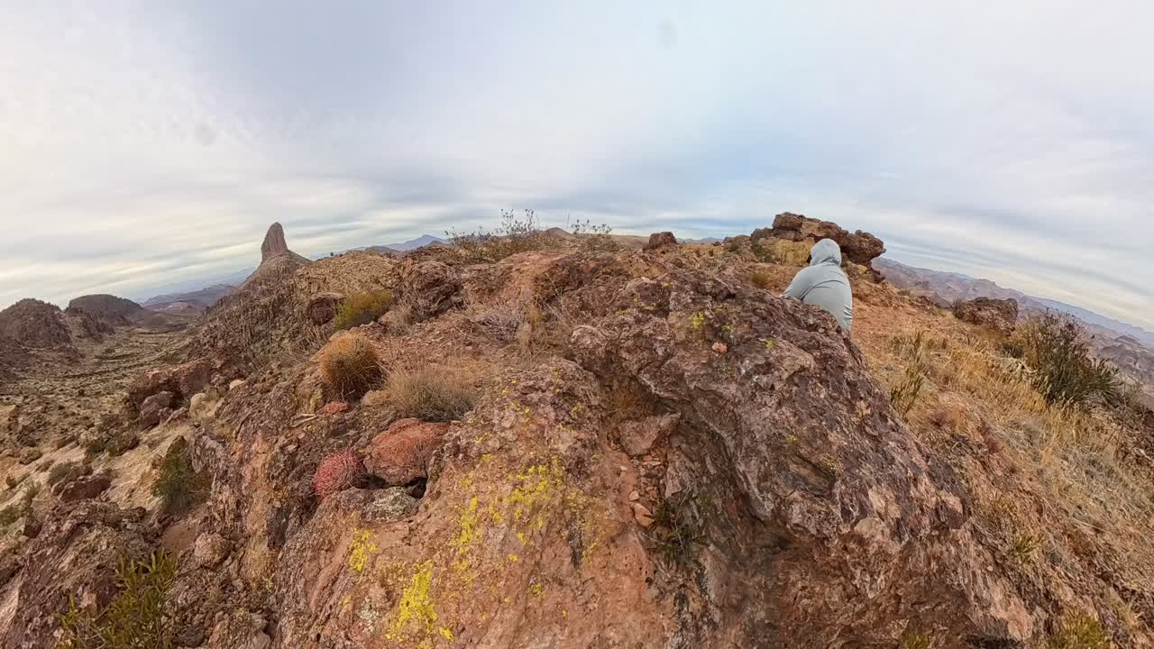Cloud Time Lapse of Weavers Needle and a hiker in the Superstition Mountains