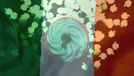 Shamrocks-in-paper-falling-on-a-muffin-against-an-Irish-flag