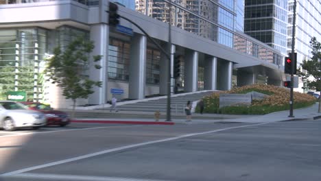 A-Car-Travels-Along-A-Street-In-Century-City-Los-Angeles-As-Seen-Through-The-Rear-Window-At-An-Angle-3