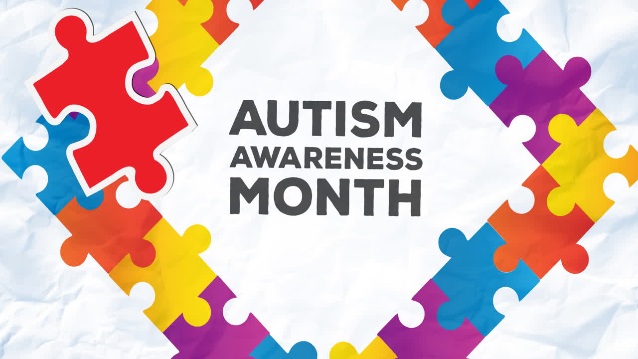 Animazione di puzzle rossi e gialli con il testo "Mese della consapevolezza sull'autismo" in una cornice con puzzle su sfondo bianco