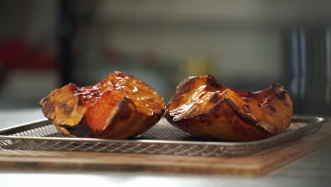 nice shot of pumpkin coming out the oven roasted being prepared with ingredients