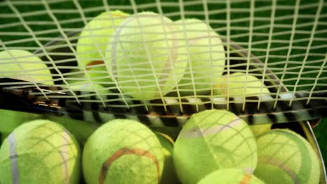 tennisballen en racket in emmer bij studio 4k