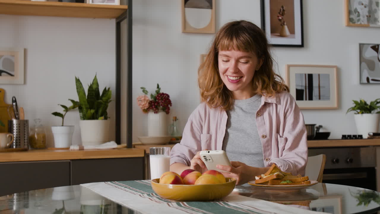 A woman enjoying breakfast at home
