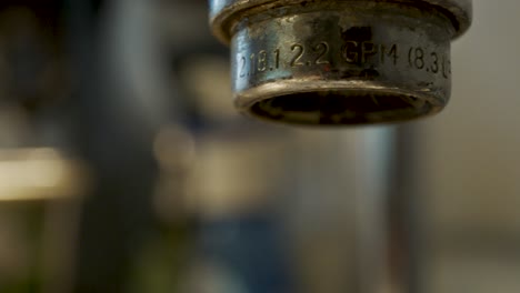 macro shot of a dripping water faucet - truck right