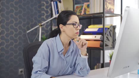 young business woman working with computer at her desk in the office.