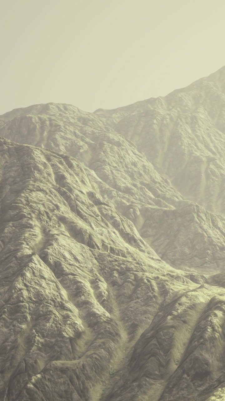 Mountains rise high with rugged terrain under a clear sky in daylight