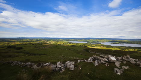 Time-lapse-of-rural-and-remote-landscape-of-grass,-trees-and-rocks-during-the-day-in-hills-of-Carrowkeel-in-county-Sligo,-Ireland